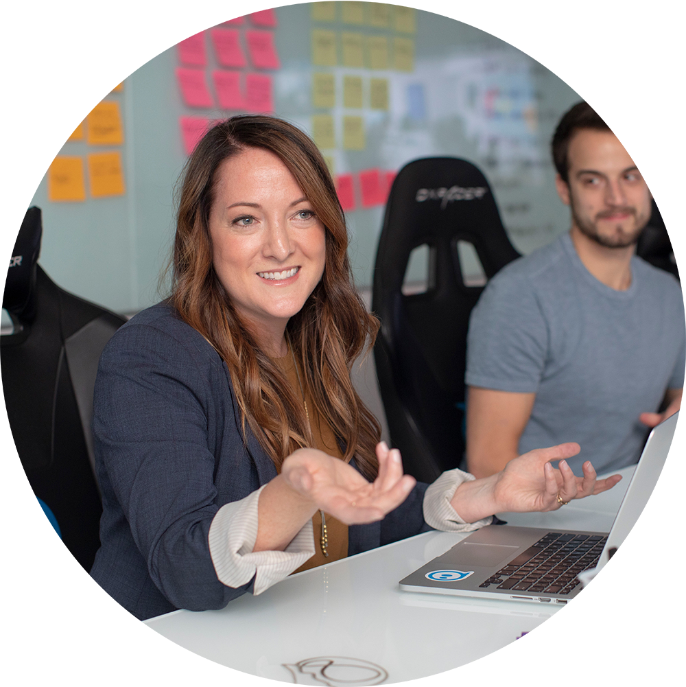 woman explaining employee benefits to her staff